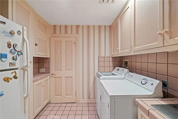 Inside laundry room with sink.