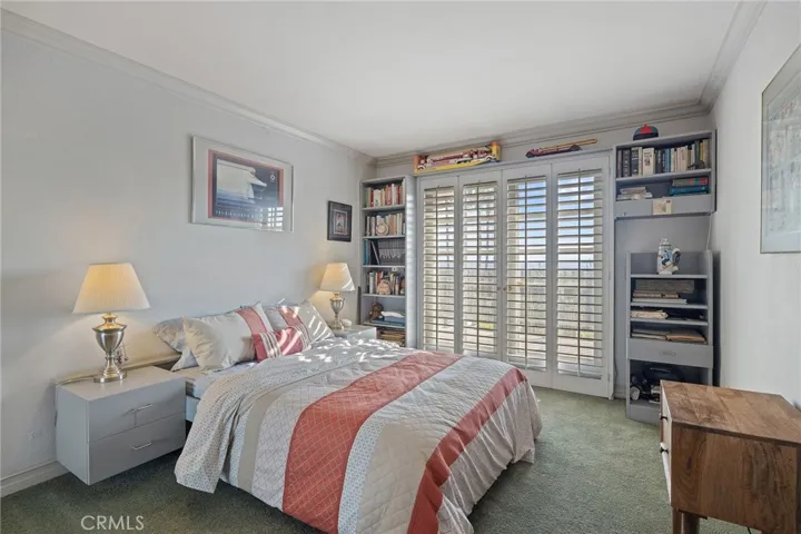 Bedroom #4 with access to balcony and city-light views.