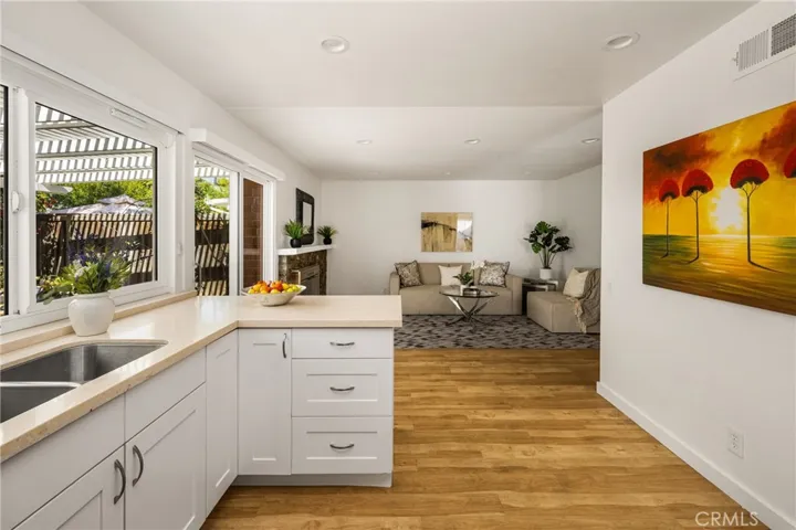 Next to the dining room is the remodeled kitchen, which opens to the family room.
