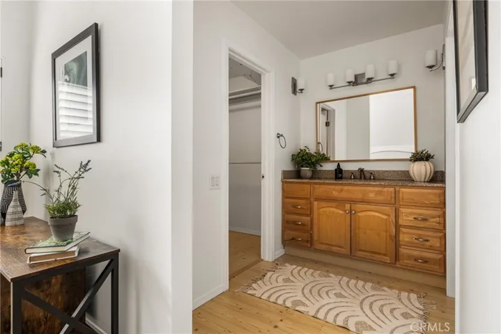 Primary features split dressing area, closet and bath with shower.