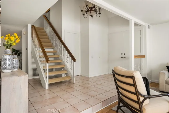 Upstairs features 3 bedrooms and the Primary Suite.