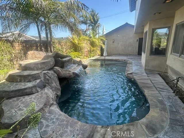 Pebble Bottom Pool with Relaxing Water Fall