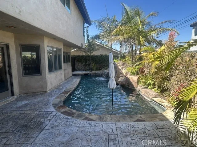 Pebble Bottom Pool with Relaxing Water Fall