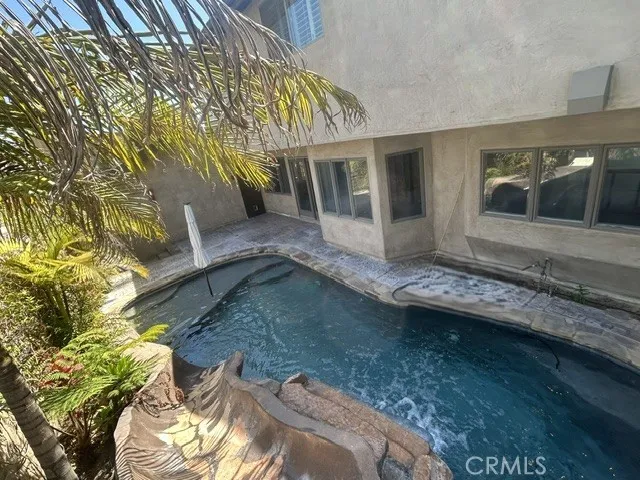 Pebble Bottom Pool with Relaxing Water Fall