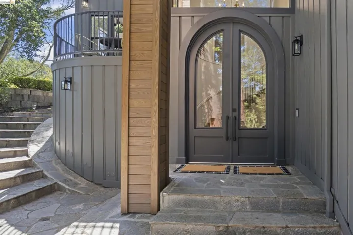 Arched double entry doors with transom window