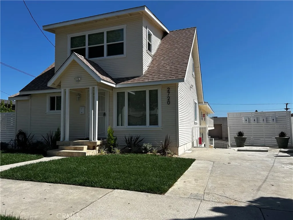 2 STORY HOUSE FRONT YARD AND DRIVEWAY