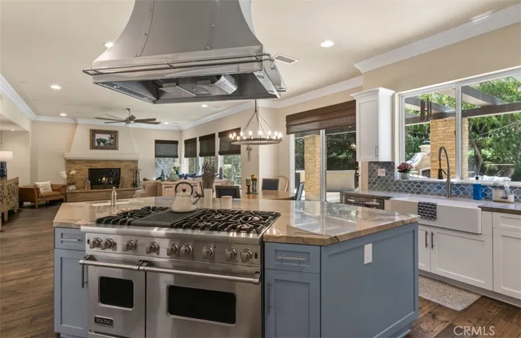 Island with building stove and vented overhead