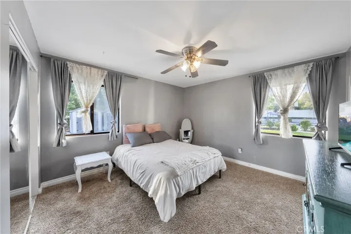 rear bedroom near laundry room with separate enterance