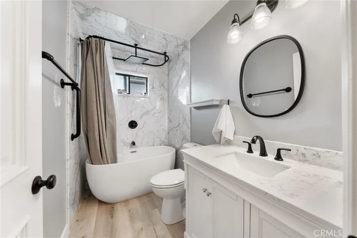 rear guest bathroom near laundry room and rear guest bedroom. this could be a separate living area for multi generational living