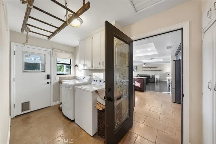 laundry room on same side of home with the rear bedroom and door that locks and can. separate this area from rear room and rear bathroom and its own private entry from back yard