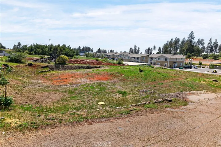 Side picture showing slope from street to level pad below.