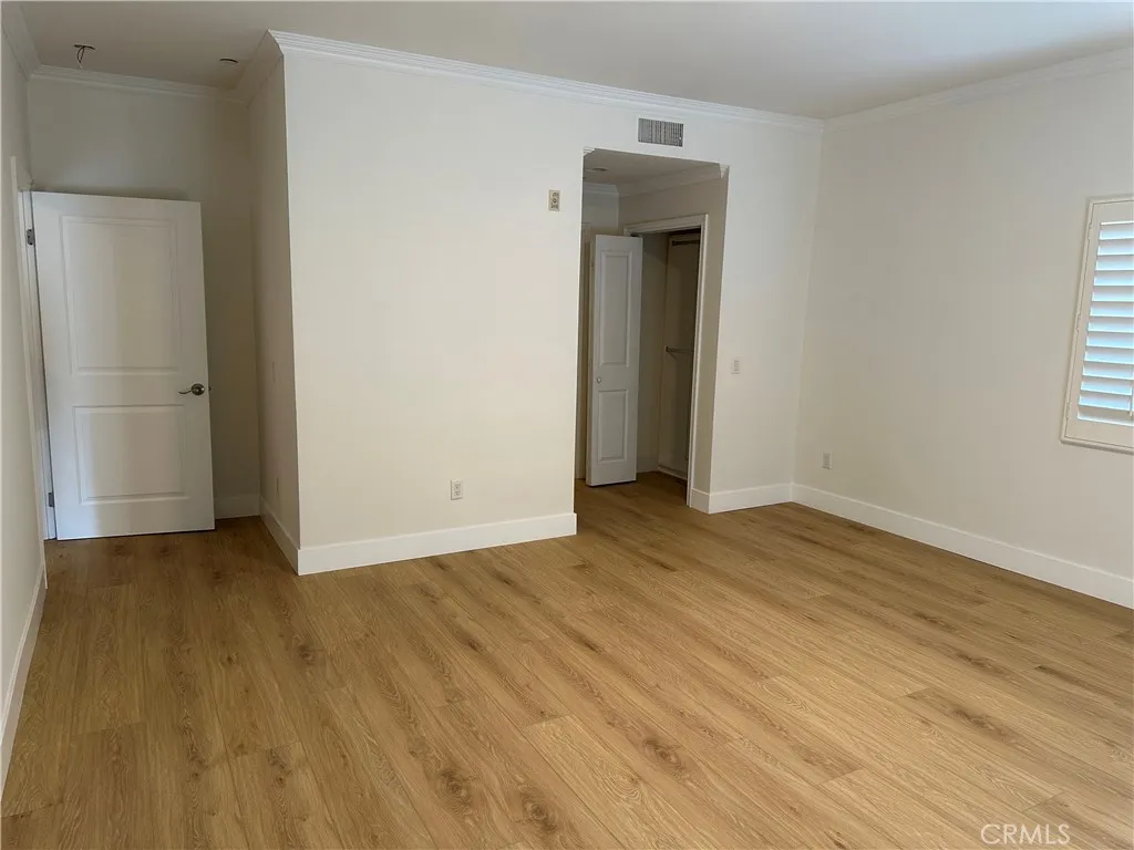 View of the primary bedroom to the closet