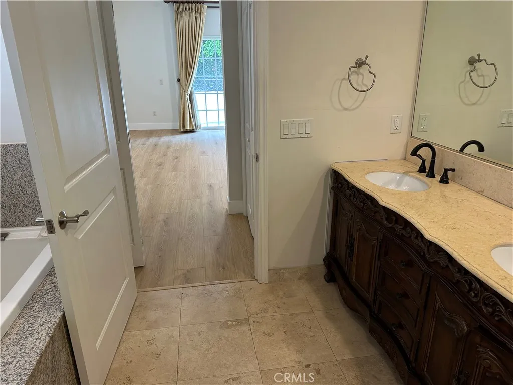 Looking out of the primary bath to the bedroom