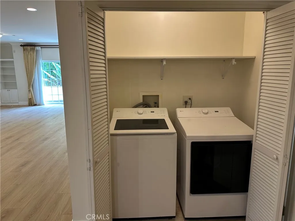 View of the inside laundry area next to the 1/2 of bath