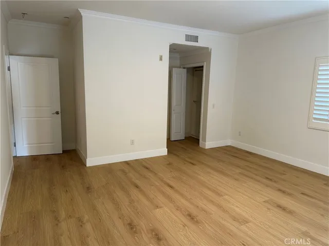View of the primary bedroom to the closet
