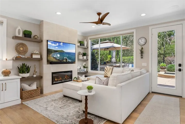 Electric fireplace can adjust heat and colors of the flames by remote control. (TV and fireplace are virtually enhanced)