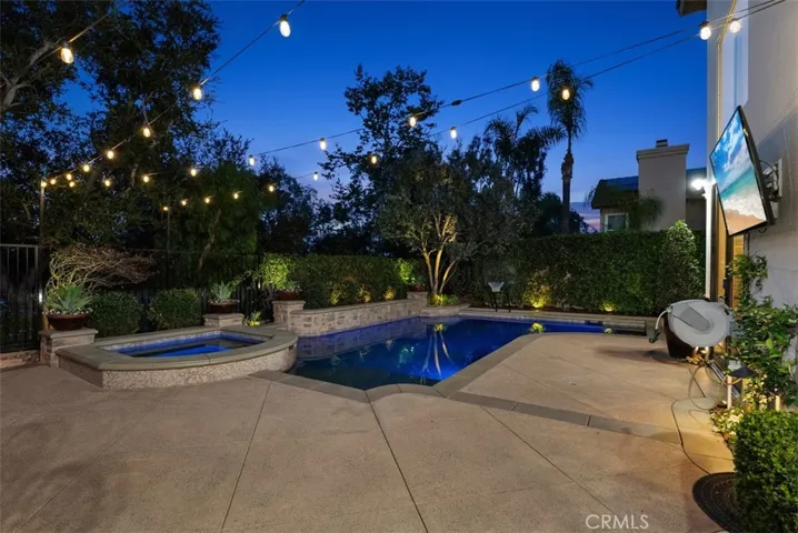 Gorgeous backyard at night. (TV is virtually enhanced)
