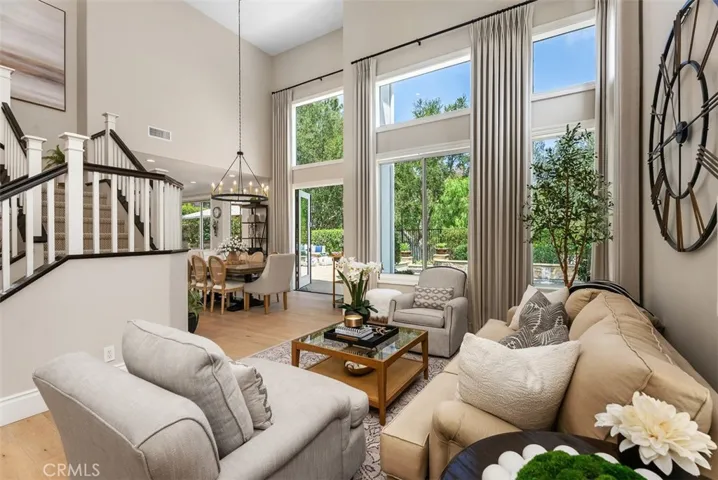 Living room open and airy, showcasing natural light and comfortable furnishings.