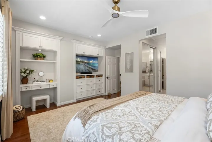 Custom built-ins and vanity within the primary suite. (TV is virtually enhanced)