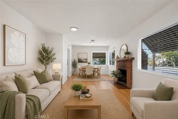 Virtually Staged Front Family Room with original hardwood floors