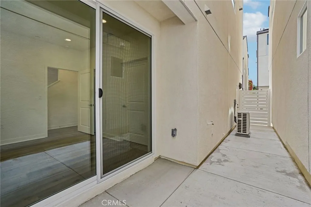 Outdoor space with fully finished concrete. Private space for bedroom.