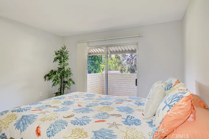 Another view of the spacious Guest Bedroom looking toward the patio.