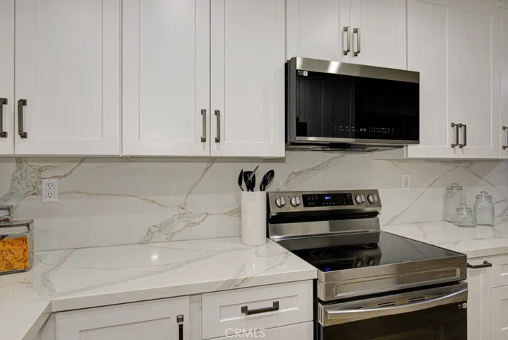 There are plenty of cabinets as well as a unique corner cabinet that slides to maximize the storage and accessibility to the back of the lower cabinet.