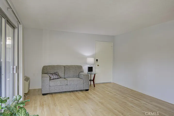 View looking toward the front entry door in the living room.