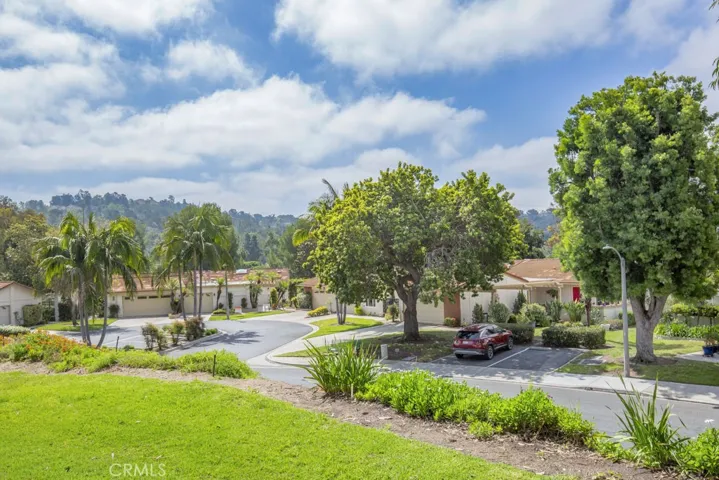 The condo faces a greenbelt with homes on the cul de sac below.  The hills in the background are in Aliso Viejo.  You'll enjoy some lights from the homes on those hills at night.