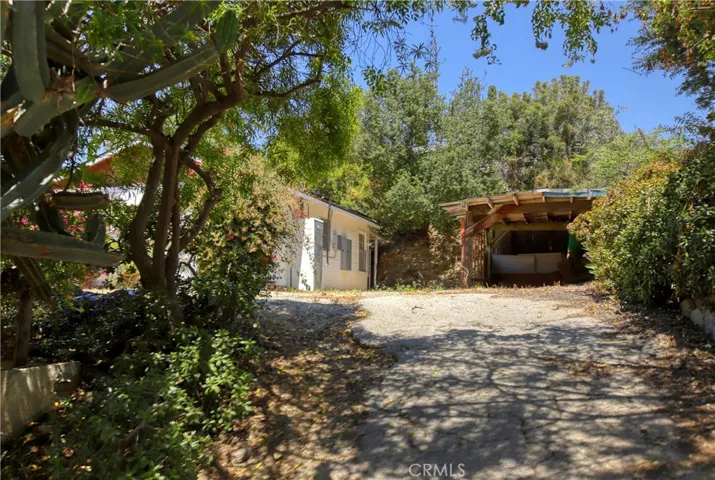 Another view of rear of main house and carport