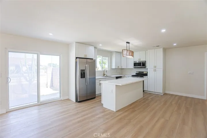 Fully upgraded kitchen featuring new cabinetry, modern countertops, and stainless steel appliances
