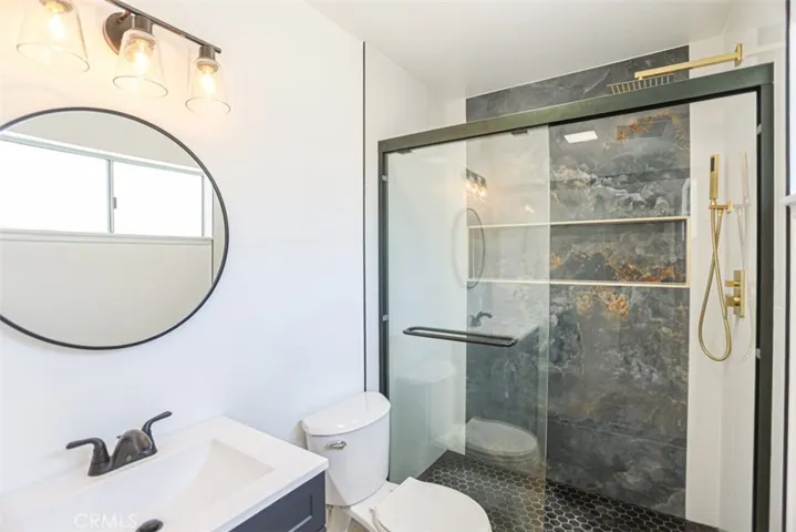Remodeled bathroom with modern vanity, upgraded fixtures, and designer touches