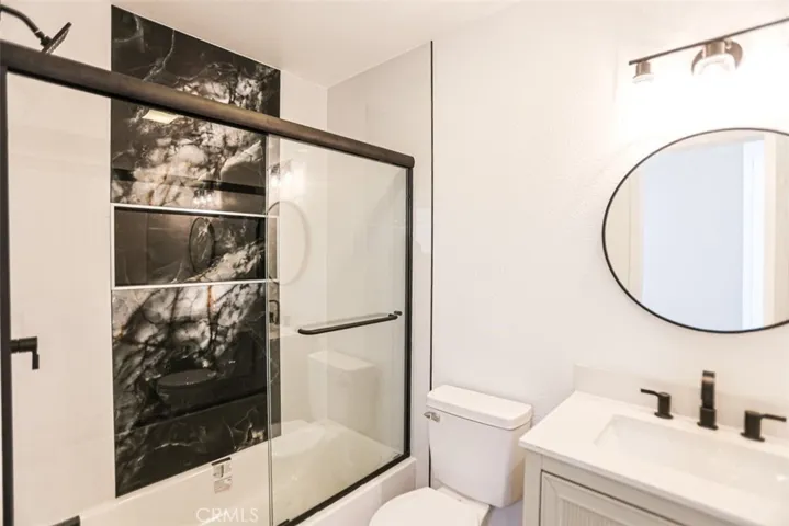 Remodeled bathroom with modern vanity, upgraded fixtures, and designer touches