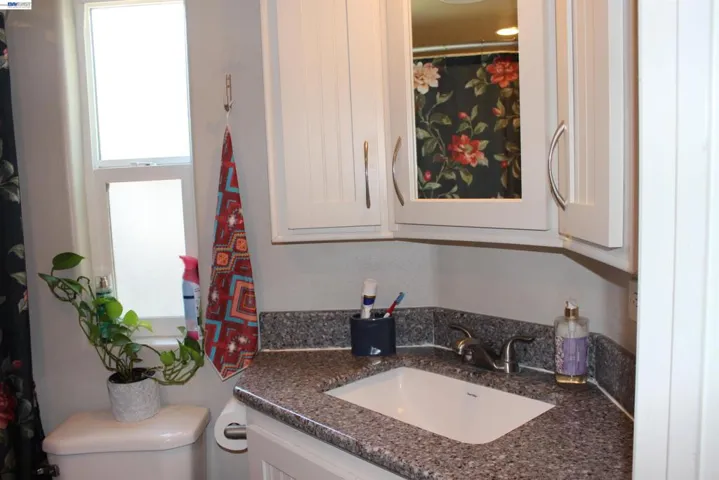 Bathroom has shower over tub.