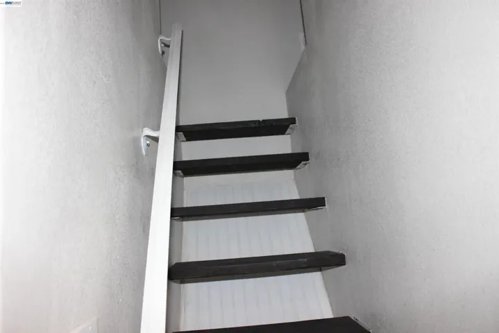 Stairs that lead to a storage area