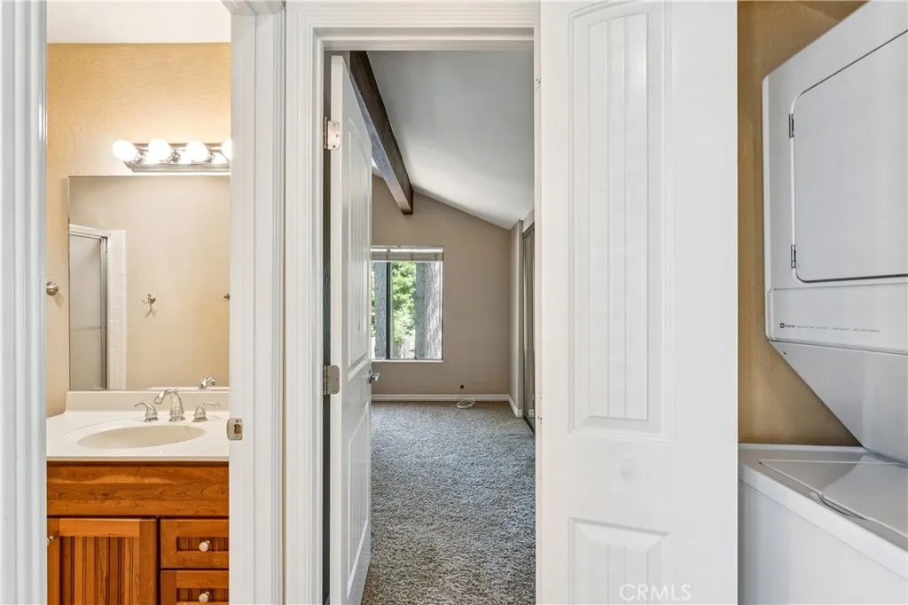 Hallway with balcony, bathroom, bedroom & laundry