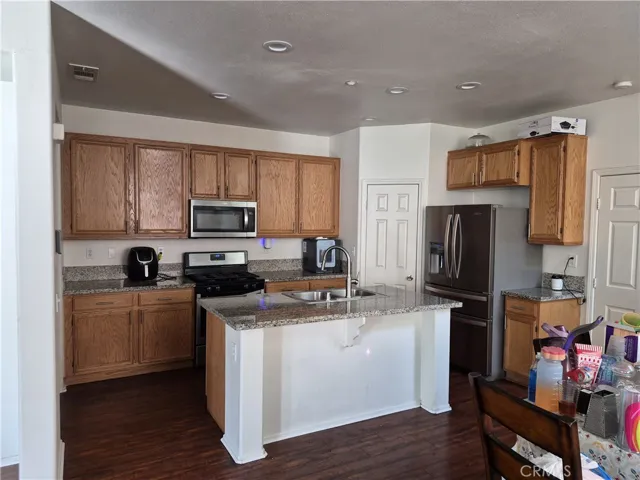 Large Kitchen. Island. Stainless Steel Appliances. Walk in Pantry.