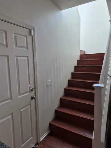 Stairway to upper Rooms. Door goes to Oversized 2 car Garage