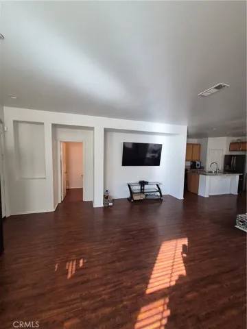 Living Room. Pictured on wall is a Built in Area for TV or Entertainment area.