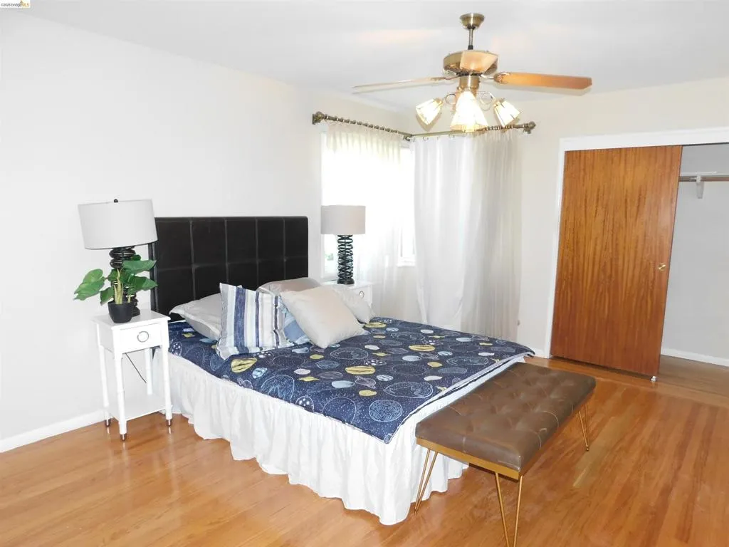 Room featuring wood-finish flooring