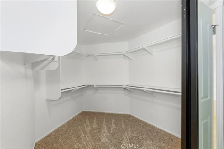 Primary Suite Walk-in closet.