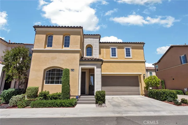 Exterior with attractive curb appeal, elegant architectural details, manicured landscaping, and an attached two-car garage, all nestled within a beautifully maintained community.