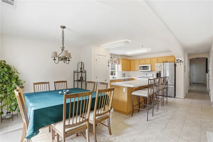 Dining Area With Kitchen In Background