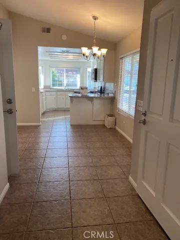 Looking through dining room nook to kitchen