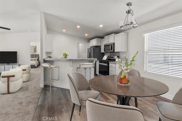 Open-concept living and kitchen virtually staged photo