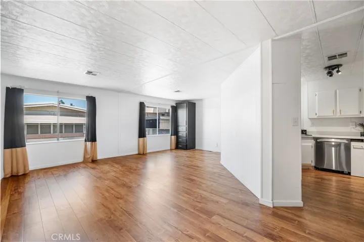 Living Room, dining area, peak a boo open floor plan to kitchen and family room