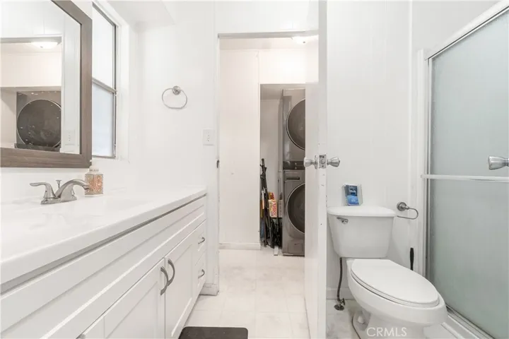 Second Bathroom different view with partial Laundry Room View