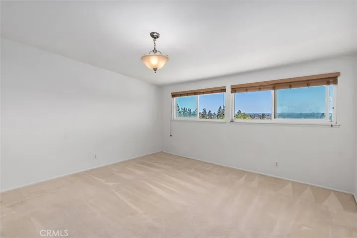 PRIMARY BEDROOM WITH A VIEW