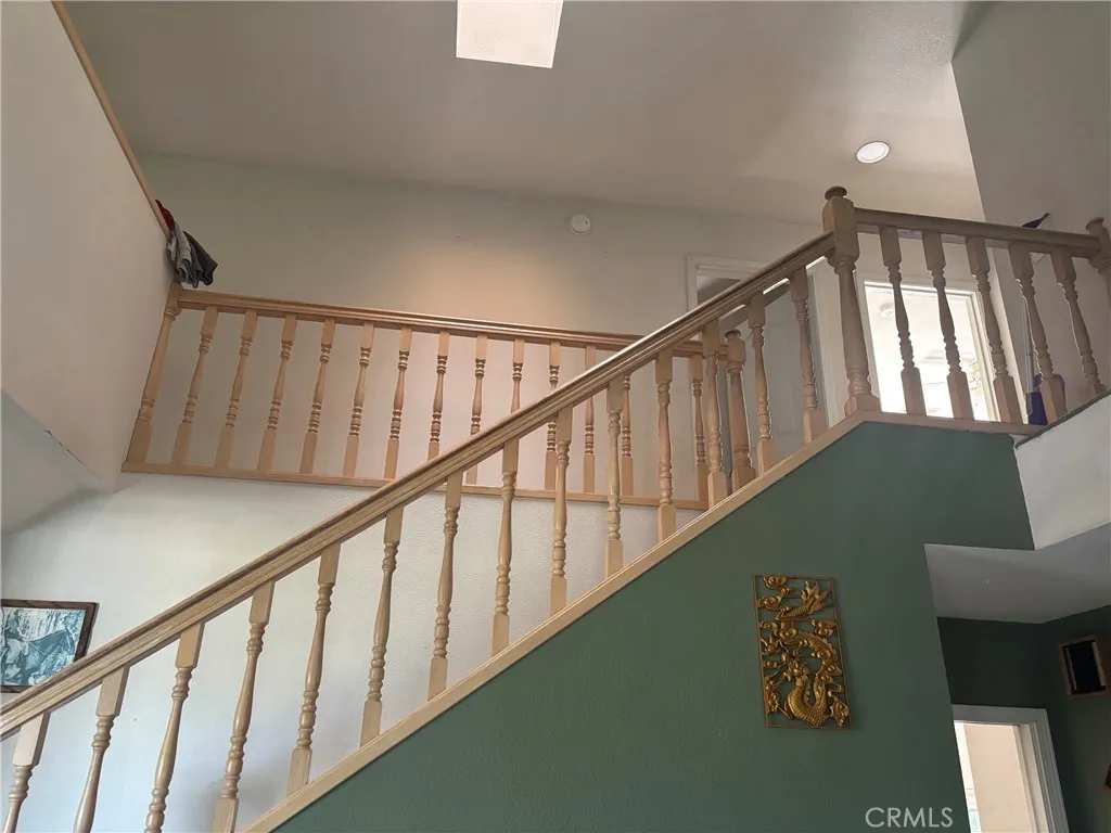 staircase to 4 bedrooms & 2 baths