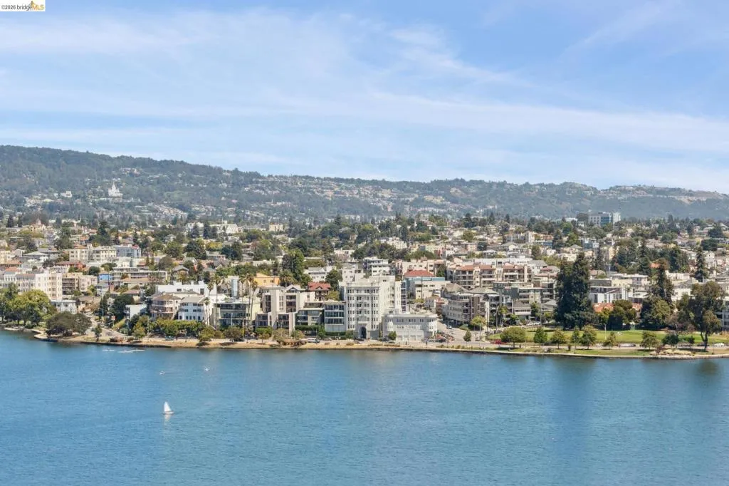 Water view featuring mountains and nearby urban area